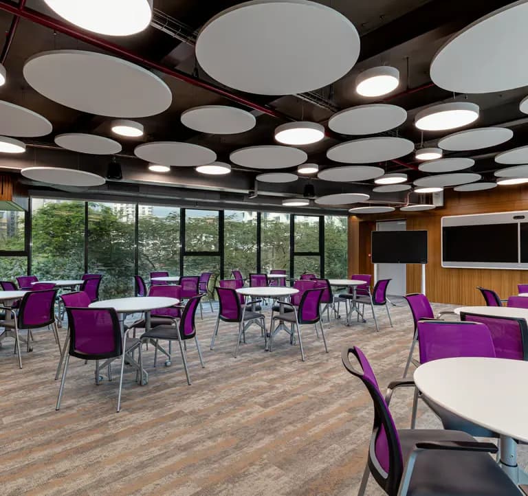 Boardroom with circular acoustic ceiling panels