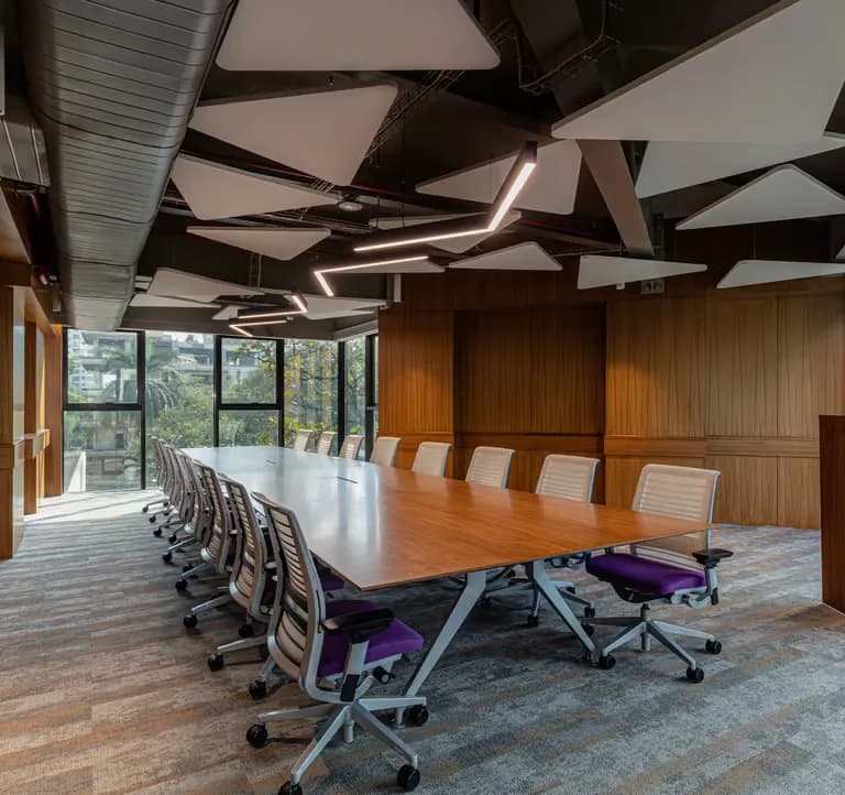 Collaborative office seating beneath acoustic discs